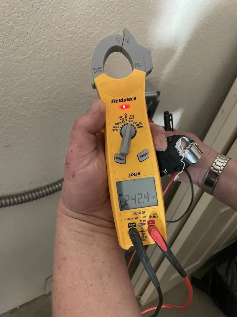 Voltage testing with clamp meter during Whole House Surge Protector in Vernon
